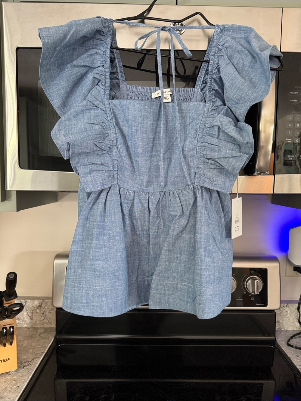 Smocked Ruffle Peplum Top in Light Blue